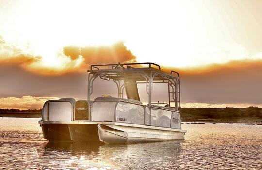 Double Decker Tritoon with Slide in Lake Travis.