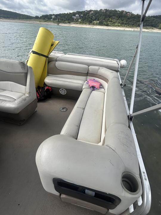 This Sun Tracker Party Barge at Canyon Lake … runs good but upholstery is weak.