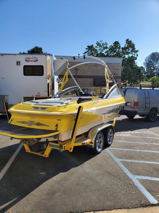 Surf the Dragon on the Yellow Tige 22ft Boat