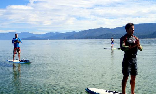 Stand steady on Lake Tahoe during our Paddle Yoga sessions.