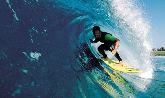 Profitez de cours de surf à Porto Pollo, en Sardaigne