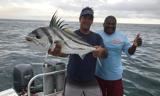 Rooster fish catch with customer and Captain Gerald