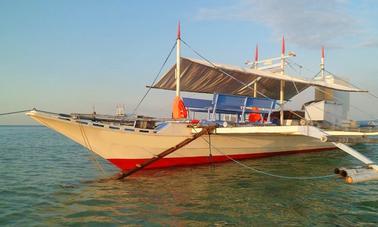 Charter a Traditional Pinoy Boat to Cruise the Mindoro Strait, Philippines