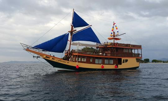 Explore Barat, Indonesia with family and friends aboard this 89' traditional phinisi boat