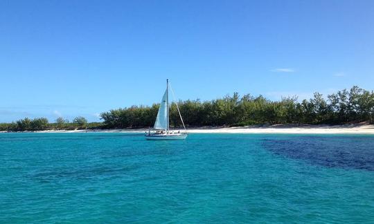 Wind Dance anchored off the reefs, and beautiful beach, at Rose Island, Nassau, Bahamas.