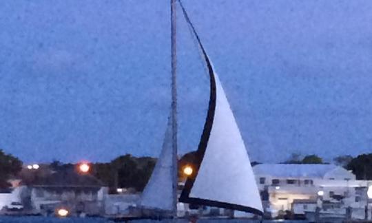 Wind Dance sailing through Nassau Harbour @ sunset.