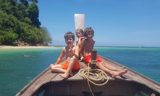 Happy children chilling on the boat near Khao Na Yak