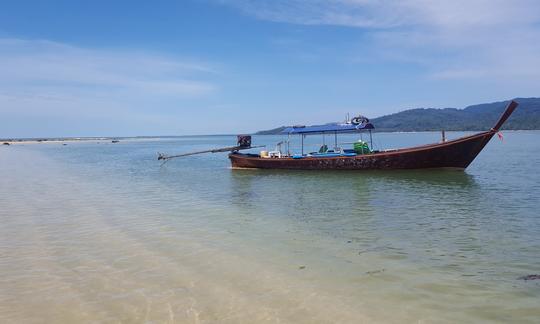 Our comfortable long-tail boat stopped by Khao Na Yak beach.