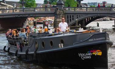 30-40 personas: 'HMS Friendship Canal Boat' en Ámsterdam, Países Bajos (100% eléctrico)