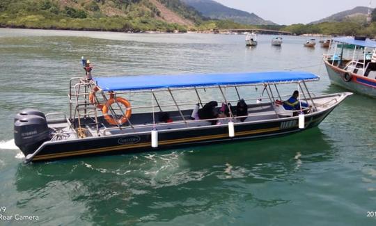 Traslado en barco desde la isla Redang a la isla Lang Tengah (1 IDA)