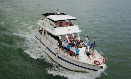 Custom Built 57 feet flybridge cruiser yacht for rent with skipper in Singapore