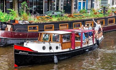 Tour privado de 2 horas o más en barco por los canales de Ámsterdam