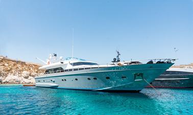 Private Boat Tour in Cyclades Islands onboard Cantieri di Pisa AKhir 27 Motor Yacht from Ornos, Mykonos, Greece