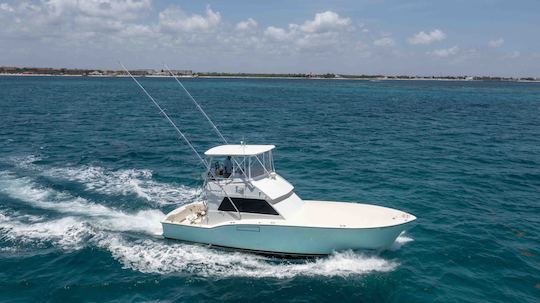 Oferta de pesca! Reserve agora! Iate 44' Hatteras para Alugar em Cancún, México.