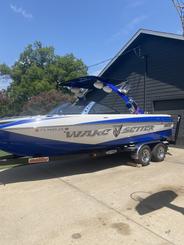 Malibu wakesetter 23’.   Gas included and captain wakeboards surf board jackets.