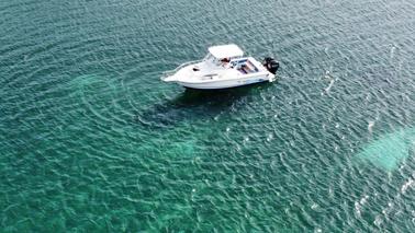 Private snorkeling and sightseeing tour with Stratos 2700 Walk Around Boat!