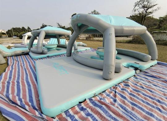 Party for up to 50 People on this Floating Oasis with 15ft Slide and Trampoline!