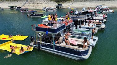 Double Decker Party Boat with a Waterslide and Lily Pad on Lake Travis