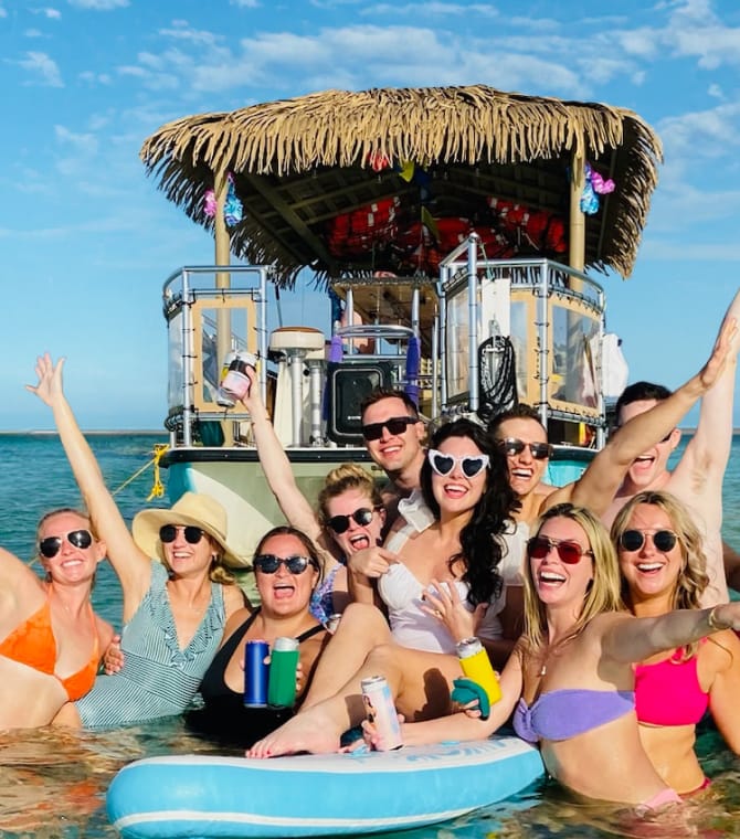 Bachelorette party crew, posing in the water.